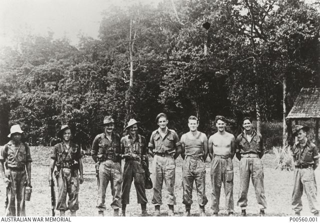 Informal group portrait of members of the Semut II team at Long Akar, Borneo. This team undertook missions behind Japanese lines. Identified left to right: WX36796 Lance Sergeant (later reverts to corporal) Abu Kassim Bin Marah; WX36793 Sergeant (Sgt) Teh Soen Hin; VB325894 Captain (later Major, Semut III) William Lomas Philip Sochon, British Army; Sgt T. Barrie; QX48608 Major Gordon Senior "Toby" Carter; NX164342 Sgt Charles Walter Pare; TX16283 Sgt Kelvin Walter Hallam; believed to be Dan Illerich USAAF; 