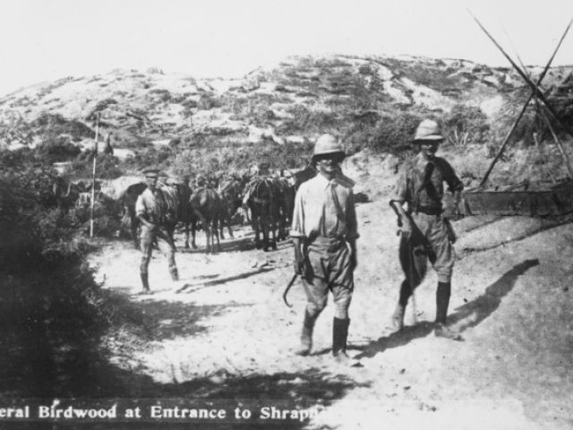 Lieutenant General Sir William Birdwood (on left, with stick in right hand) on his rounds at the entrance to Shrapnel Gully, Anzac, 1915. 
