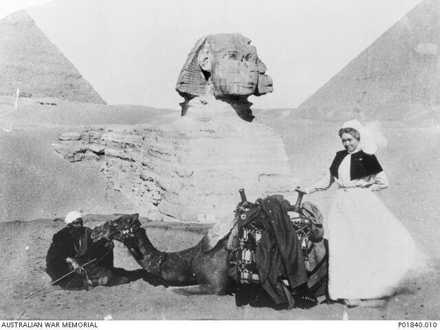 Sister Mary A. (Bessie) Pocock in front of the sphinx and pyramids, Mena, Egypt circa1915